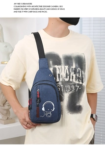 Blue canvas chest bag with luminous astronaut print shown on model for size and scale