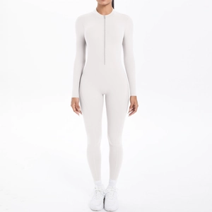 Close-up of the breathable high-stretch fabric and front zipper on the grey bodysuit