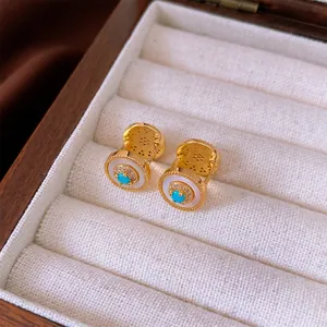 Gold plated vintage sunray earrings with turquoise stone and pearl inlay in jewelry box