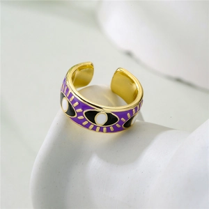 Detailed view of the 18K gold plated evil eye ring with purple enamel finish