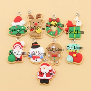 Flat lay of colorful DIY Christmas resin pendants with size specifications in mm