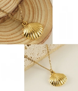 Macro shot of gold stainless steel shell pendant featuring 365-day color retention quality