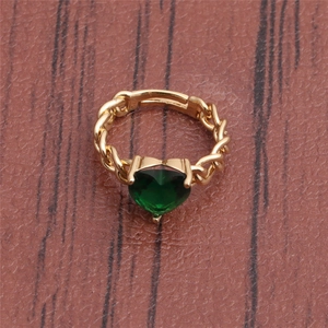 Top view of a gold chain style ring with a deep green heart-shaped emerald crystal