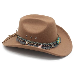 Detail of brown wool cowboy hat featuring bohemian tassel band and turquoise stone