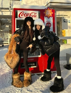 Brown heart-shaped faux fur handbag and matching fluffy boots in a winter snow scene
