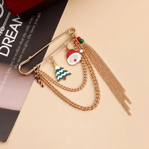 Detail of Christmas enamel charms with golden safety pin and long tassel chains