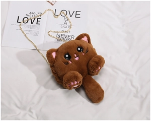 Detailed shot of brown plush cat shoulder bag featuring soft fur and golden chain strap