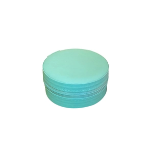 Light blue circular travel jewelry box with zipper and textured finish on white background