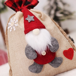 Linen Christmas drawstring gift bag with faceless Santa gnome and snowflake patterns