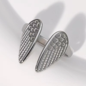Minimalist stainless steel open ring featuring a polished silver wing feather design