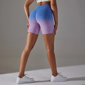 Macro view of seamless high-waisted gym shorts featuring blue-to-purple gradient shading