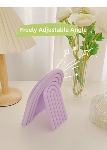 Close-up of a purple wavy foldable vanity mirror with an adjustable angle design