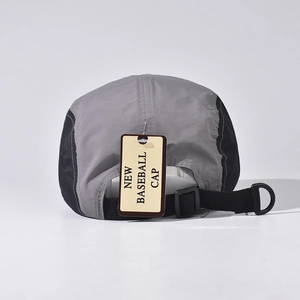 Rear view of a grey and black five-panel baseball cap with D-ring and adjustable buckle