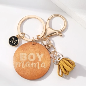 DIY wood keychain with BOY mama engraving, gold ring, black M charm and yellow suede tassel