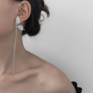 Elegant silver butterfly long tassel earrings on a model for a stylish party look