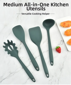 Macro view of four-piece green heat-resistant silicone kitchen utensil set on marble