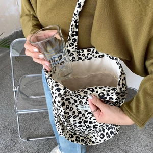 Internal view of leopard print canvas tote bag showing spacious storage and inner compartment
