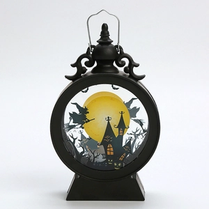 Detail of black Halloween lantern with witch silhouette and warm glowing moon background