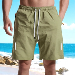 Men's olive green quick-dry beach shorts with zipper pockets and adjustable drawstring