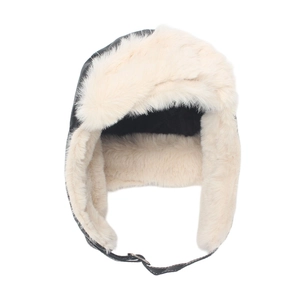 Detail of winter trapper hat featuring black faux leather and warm cream fleece lining