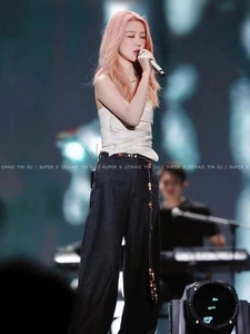 Ethnic style long beaded woven leather waist chain belt accessory shown on singer onstage