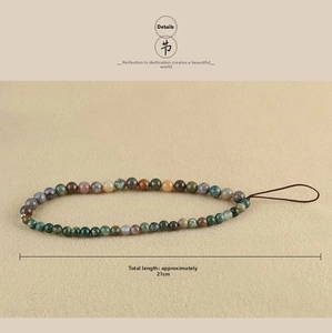 Detail of 21cm handmade phone strap featuring multi-color agate and turquoise beads