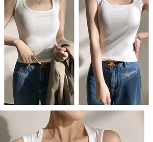 Detail of white cotton tank top paired with denim jeans and golden triomphe belt
