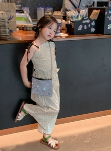 Detail of silver rhinestone crossbody bag for kids with luxury chain and sparkling finish
