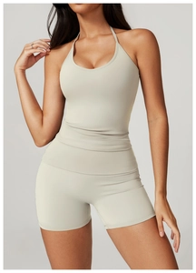 Detail of off-white halter yoga set showing the high-stretch fabric and slim fit design