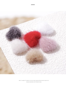 Detailed view of colorful plush heart-shaped charms for sweaters and nail art accessory
