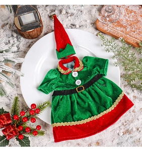 Detailed view of Christmas elf bottle dress and hat set on festive table decor