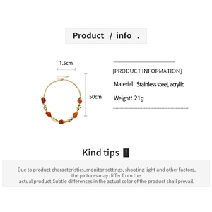 Detail view of acrylic and stainless steel necklace with size, weight, and material specs