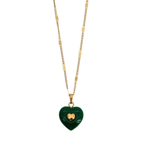 Elegant gold necklace featuring a green heart pendant with a small centered gold heart