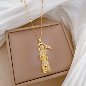 Detail of Santa Muerte pendant with sparkling rhinestones on golden chain necklace