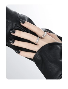 Detail showing S925 silver couple rings with twisted texture and small inlaid diamonds