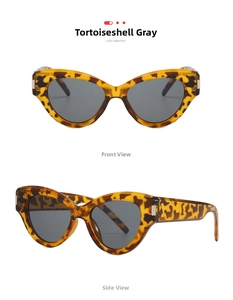 Detail view showing tortoiseshell cat-eye sunglasses with gray lenses and silver metal hinges