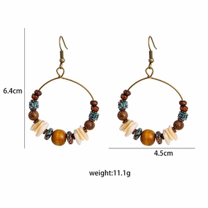 Detail view of ethnic hoop earrings with wooden beads and turquoise shells, 6.4x4.5cm size