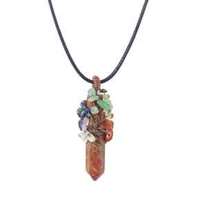 Macro detail of handmade wire-wrapped Tree of Life pendant with hexagonal gemstone