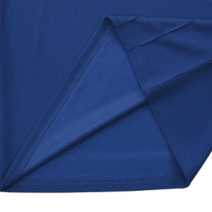 Detail shot of navy blue waffle knit fabric showing texture and high-density stitching