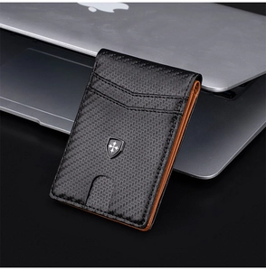 Detail of RFID carbon fiber men's wallet featuring a shield logo on a metal badge