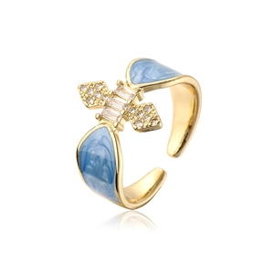 Detail of 18K gold plated ring with blue enamel and micro-paved cubic zirconia accents