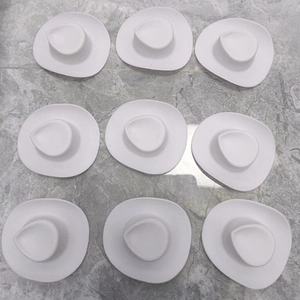 Nine white mini cowgirl hats with cow print pattern for DIY craft and doll accessories