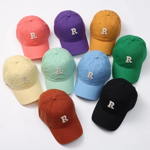 Collection of colorful cotton baseball hats with R letter embroidery in nine vibrant shades