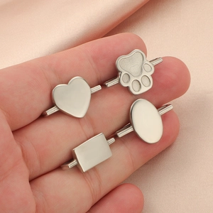 Set of four silver metal decorative charms for smartwatch bands in various shapes