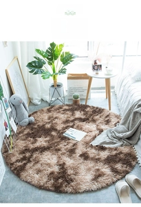 Detail of soft dark coffee plush round rug with thick fibers for home bedroom decor