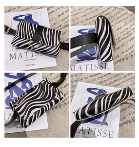 Detailed views of zebra print small waist bag with black faux leather belt and gold buckle