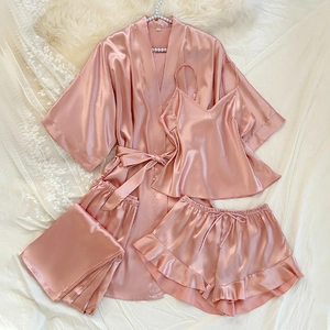 Pink 4-piece satin pajama set with lace trim and silk-like finish for a soft home feel