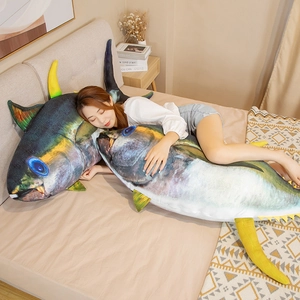 Detail of creative large tuna plush pillow showing soft texture in a cozy bedroom setting