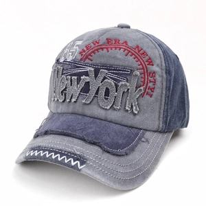 Detail of washed cotton baseball cap with vintage New York embroidery and contrast stitching