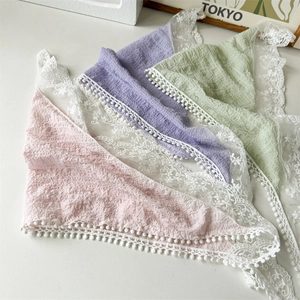 Three-pack of floral lace panties in pink, purple, and green with white ruffled edges